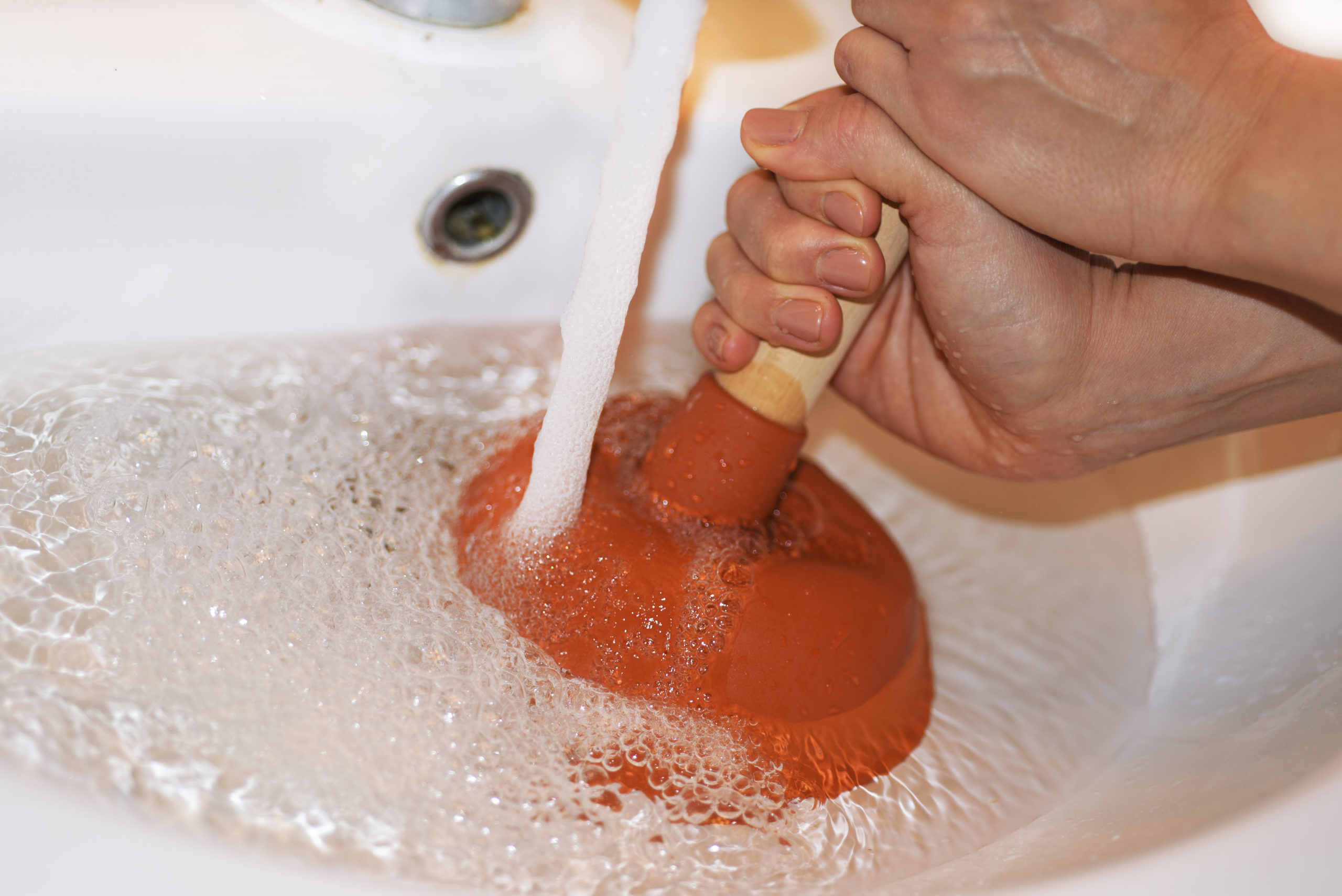 Using a plunger on a clogged sink | Clogged Drains